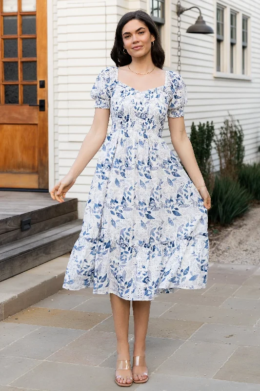 Midi dresses with pom - pom trims for a playful and festive look Piper Eyelet Midi Dress | Off White + Blue Floral Midi dresses with pom - pom trims for a playful and festive look Piper Eyelet Midi Dress | Off White + Blue Floral