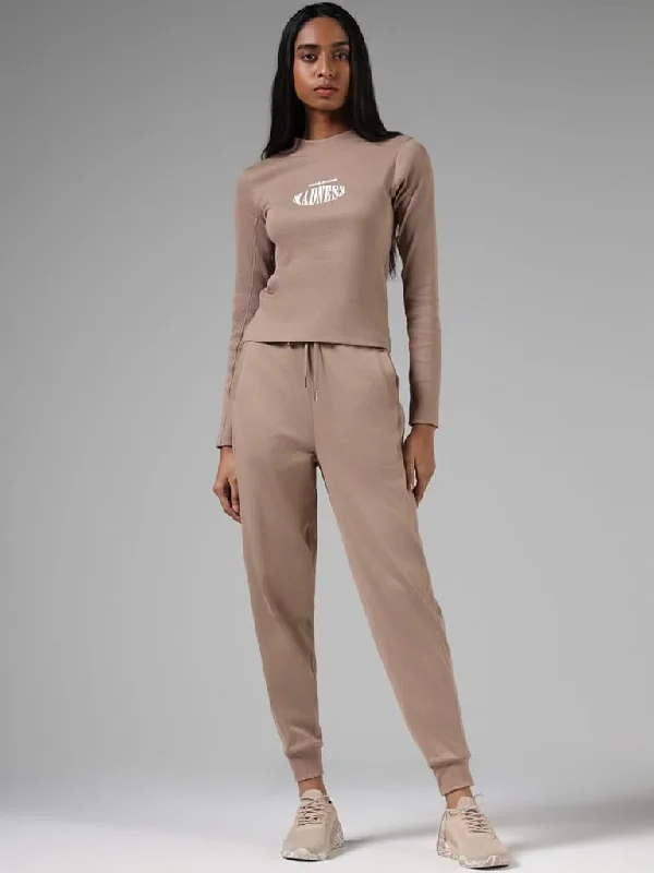 Women's pants for office meetings High - waisted women jeans for a flattering silhouette Studiofit Solid Beige Cotton Relaxed-Fit Mid-Rise Joggers Women's pants for office meetings High - waisted women jeans for a flattering silhouette Studiofit Solid Beige Cotton Relaxed-Fit Mid-Rise Joggers